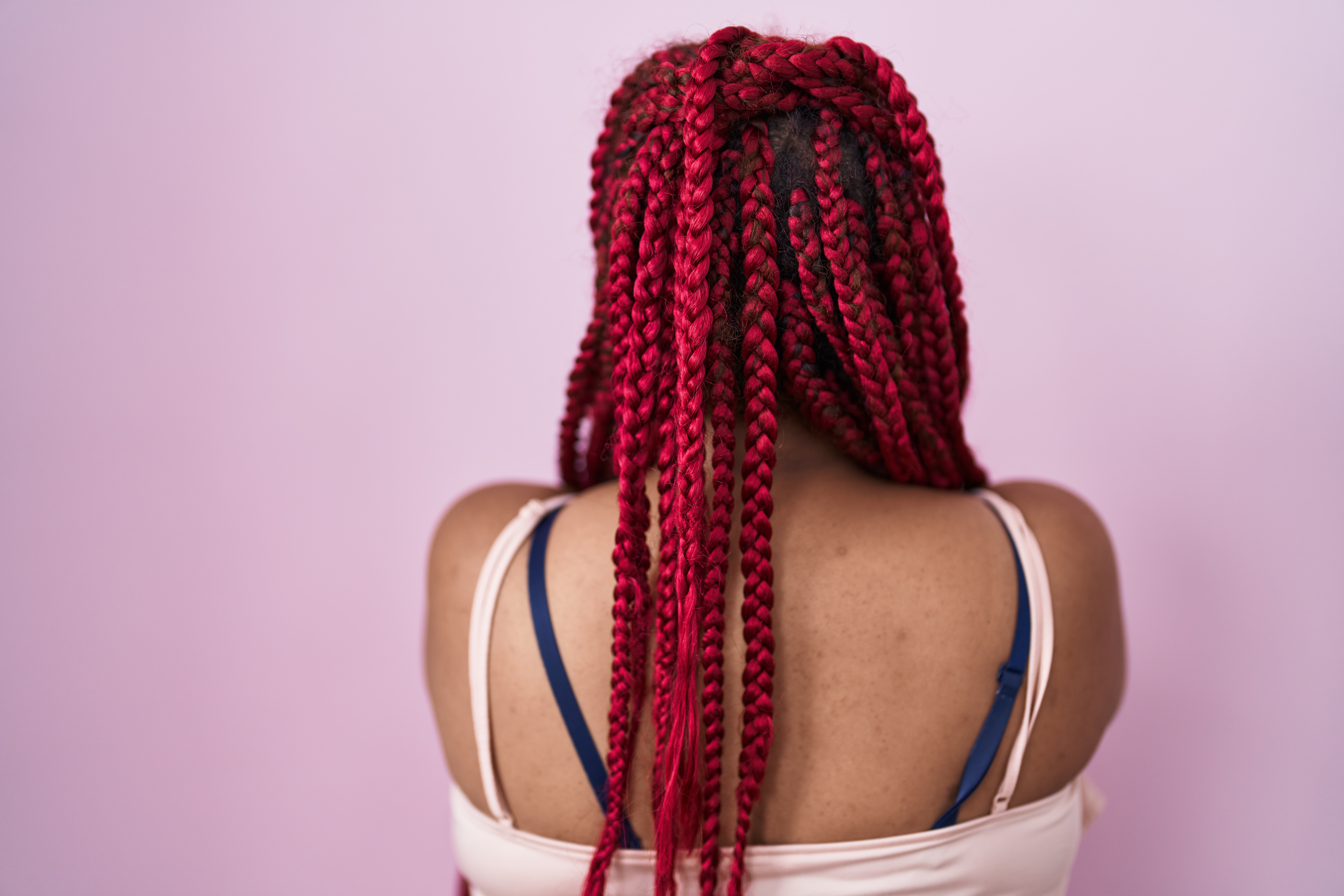 Close-up of intricate cornrow braiding technique